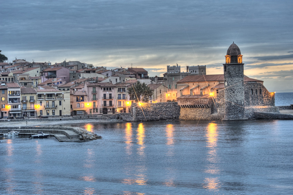 Sunset at the French coastal village of Collioure (Credit: jeangill / Istock.com)